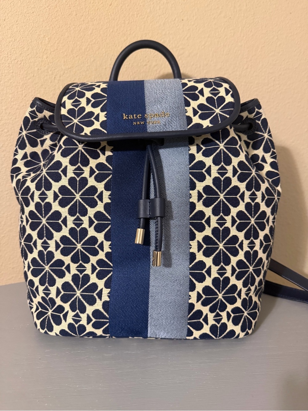 kate spade floral navy and cream canvas backpack with stripe